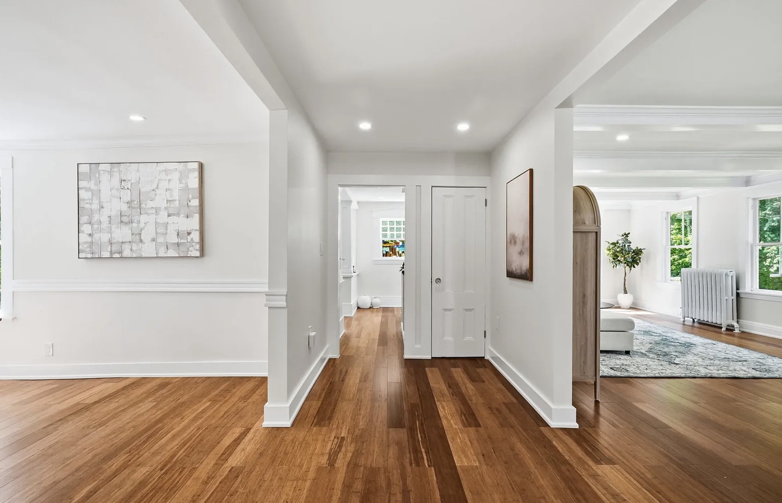 Professionally staged entry staircase and open-plan interior after renovation in Wayland Massachusetts — view 3