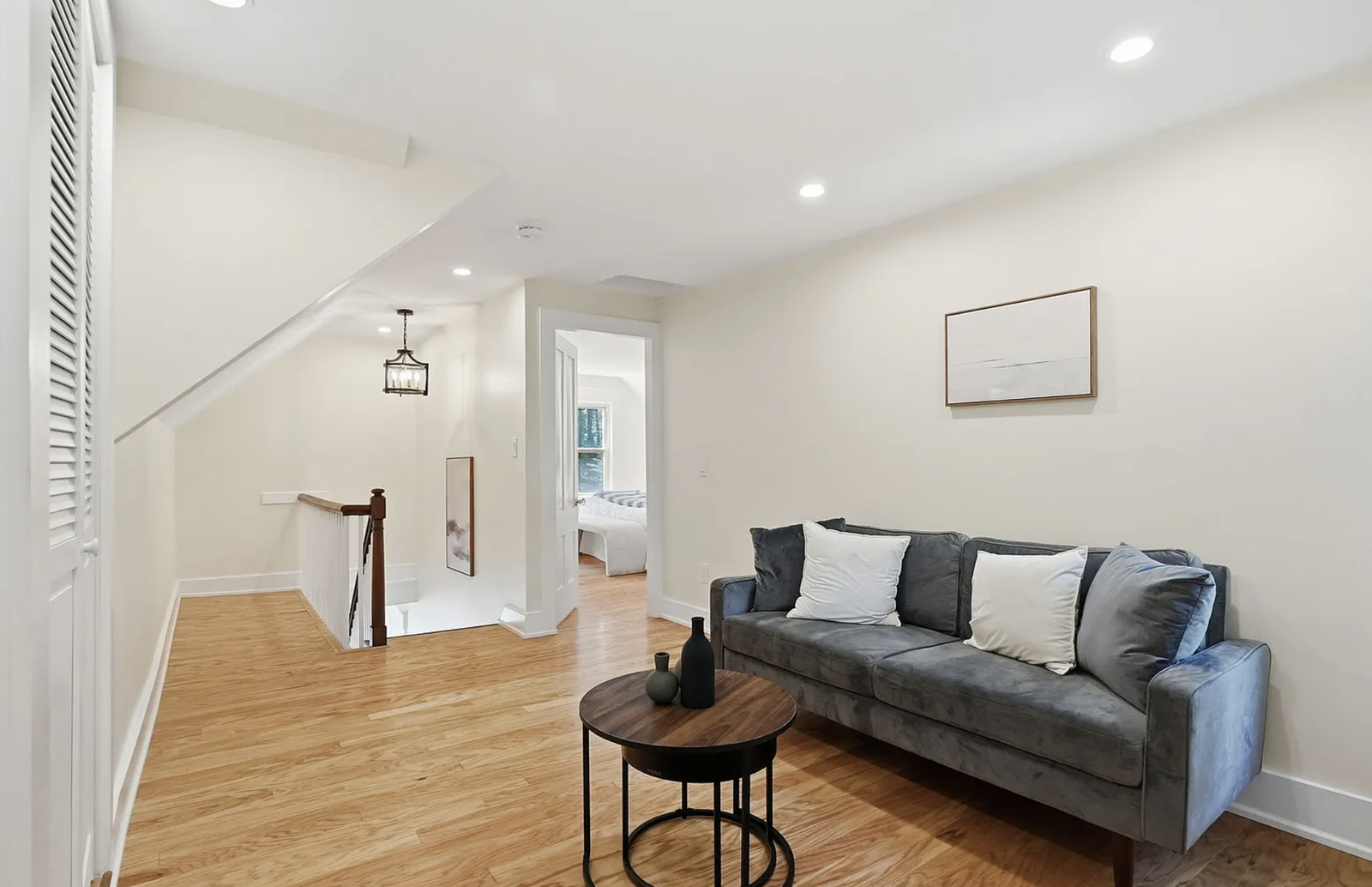 Professionally staged bedroom and upper-floor room after renovation in Wayland Massachusetts — view 2
