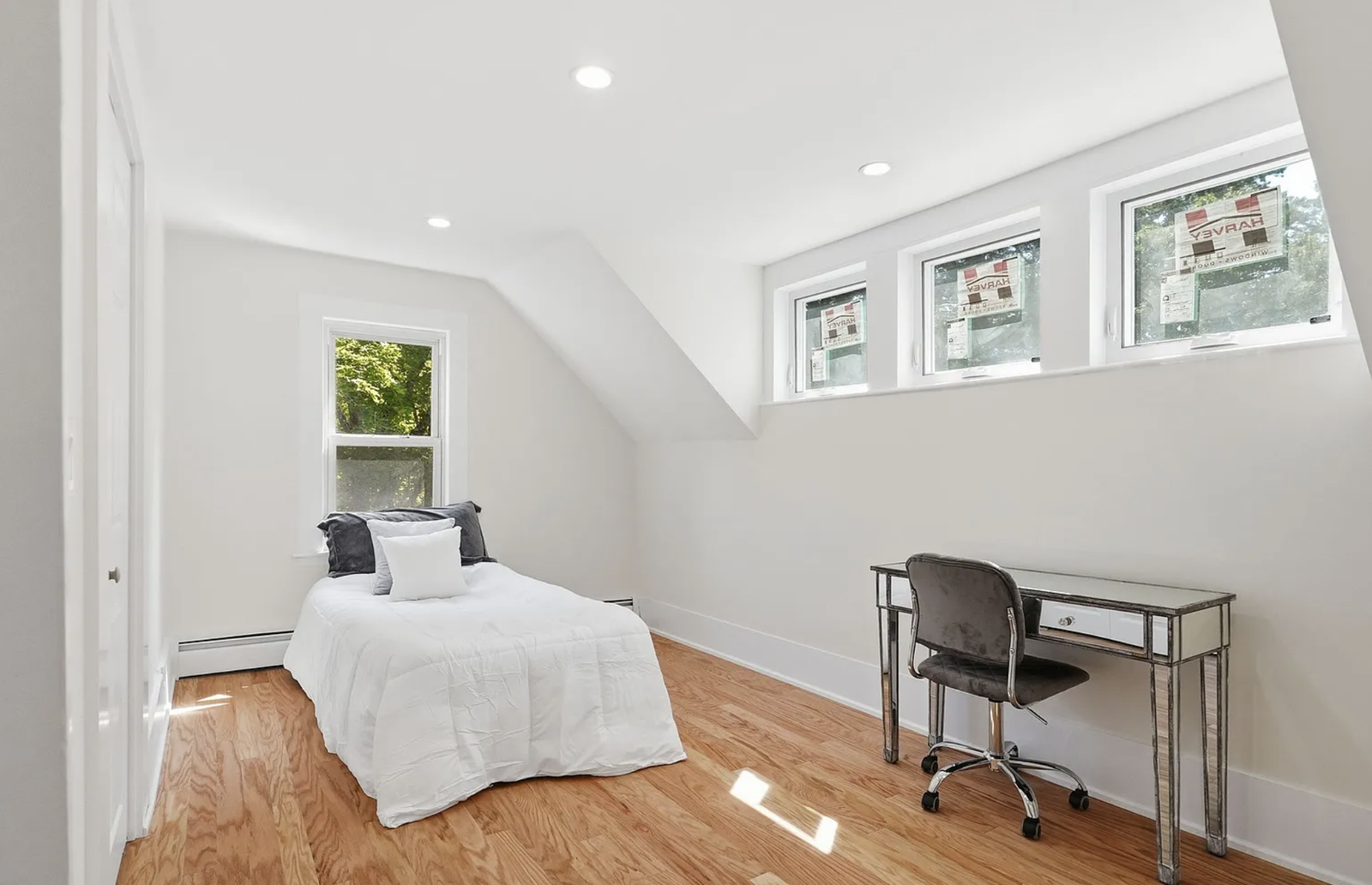 Professionally staged bedroom and upper-floor room after renovation in Wayland Massachusetts — view 6