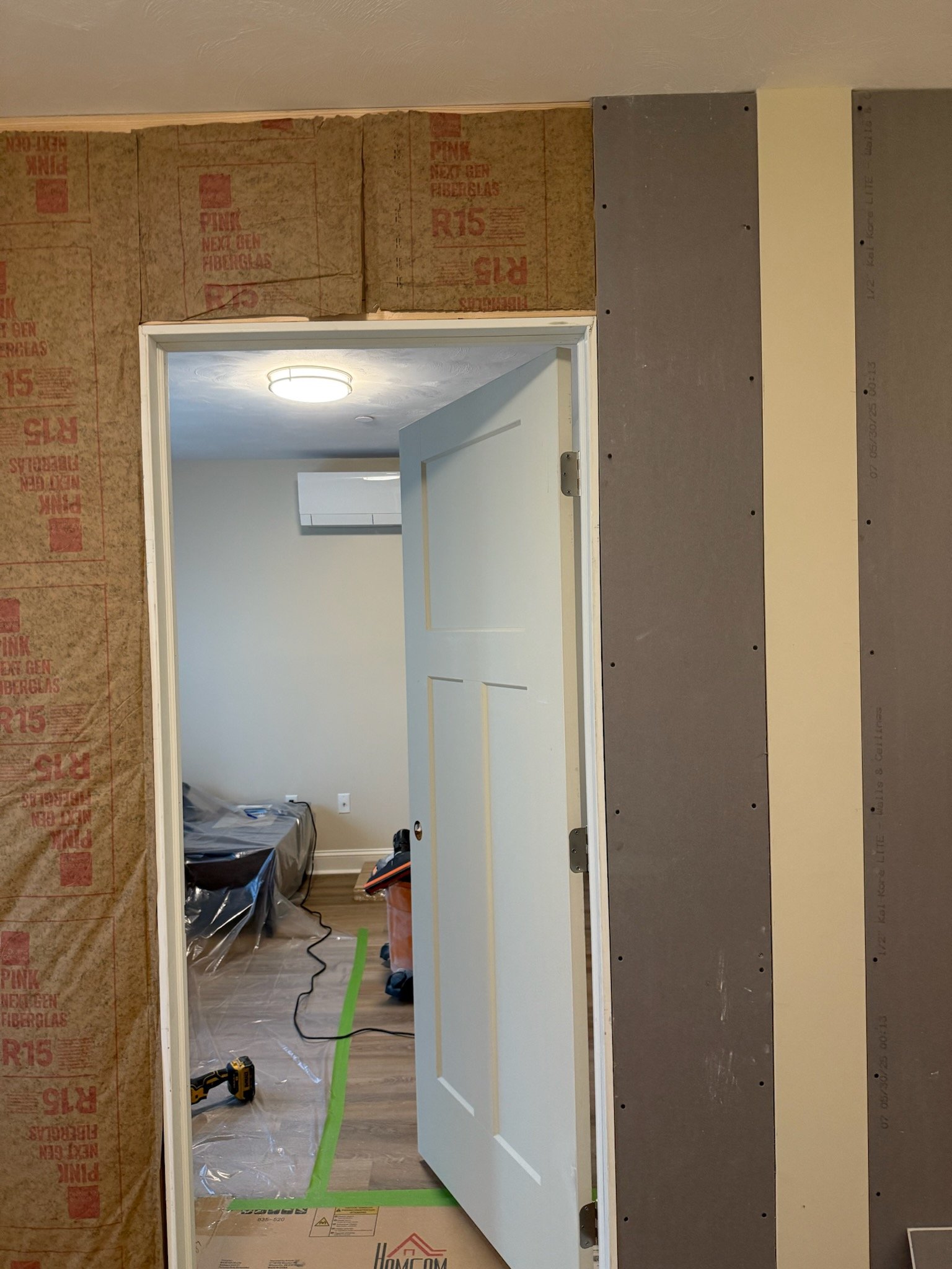 New wall framing and doorway opening during Wilmington guest bedroom conversion