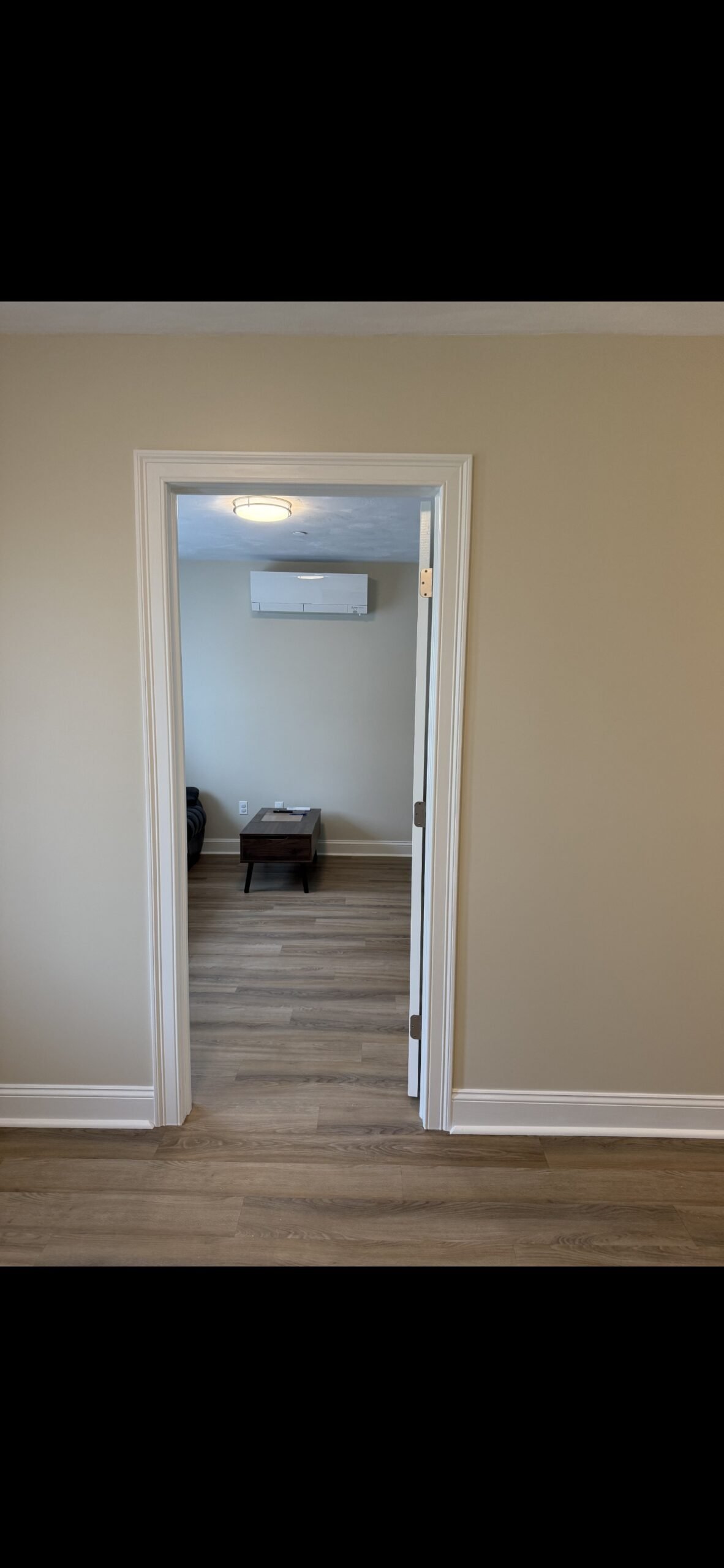 Completed guest bedroom entrance matching the existing Wilmington home