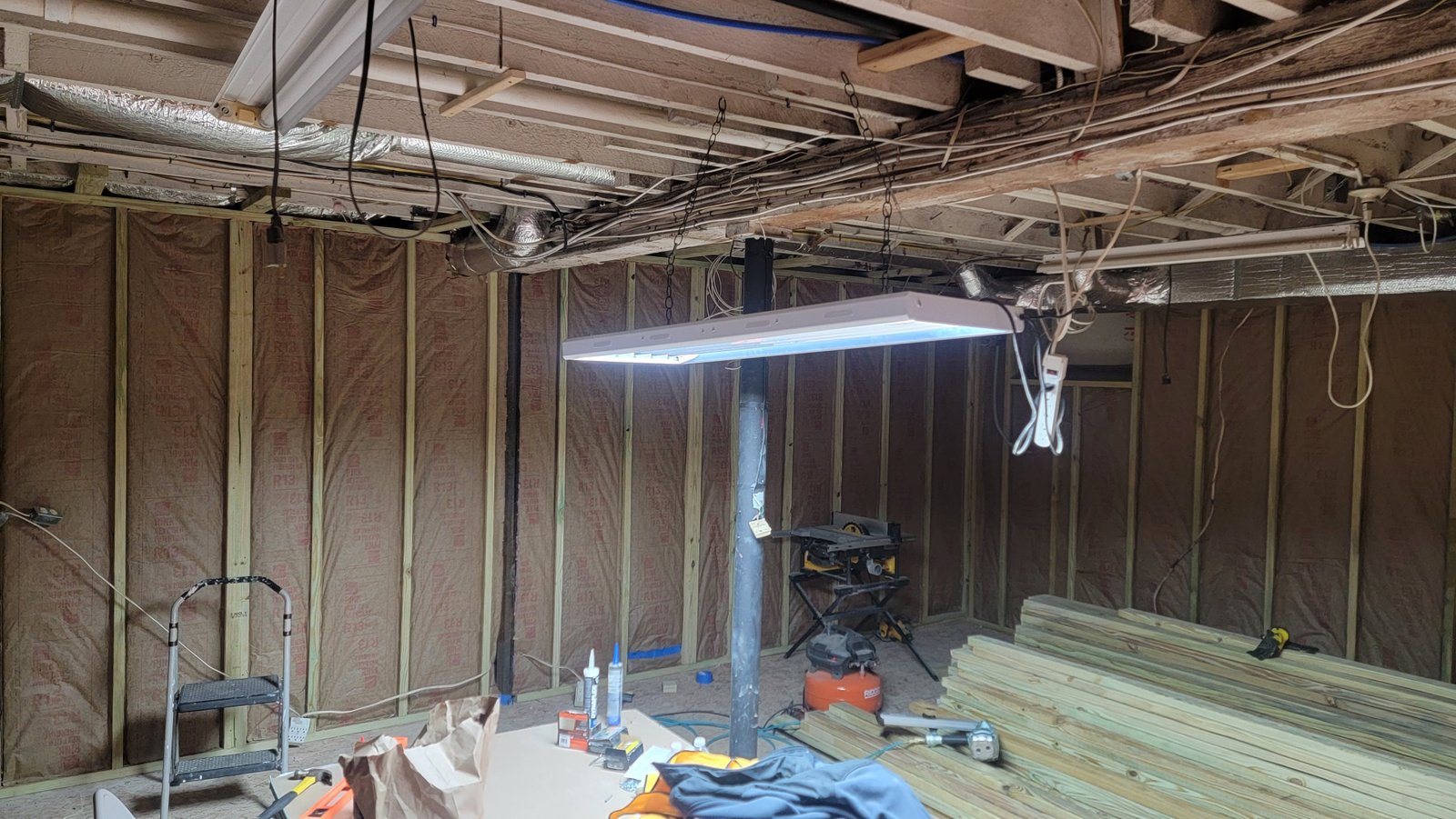 Batt insulation installed between newly framed basement walls in Marblehead Massachusetts
