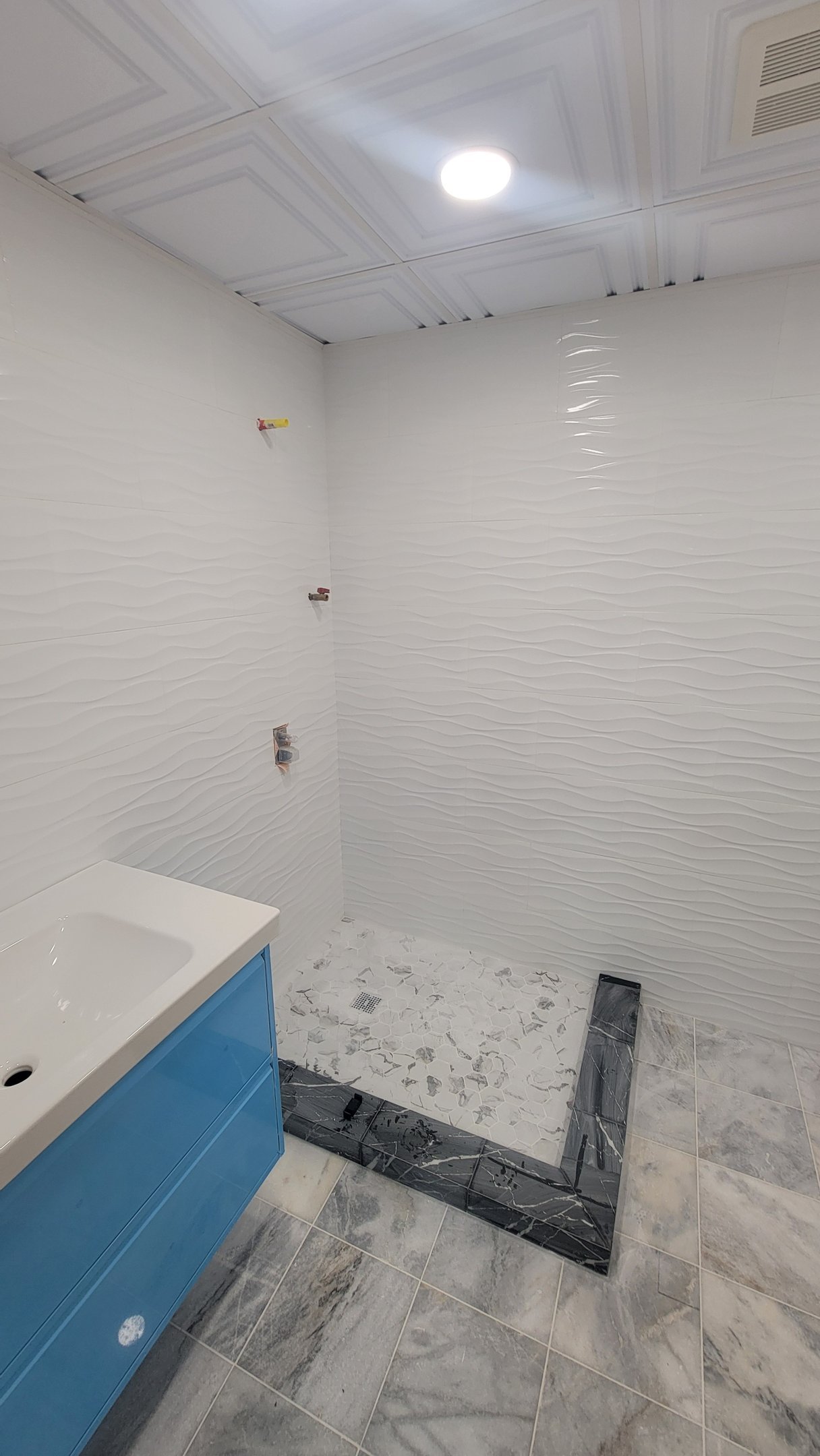 Bathroom tile and fixture preparation near completion in Marblehead Massachusetts